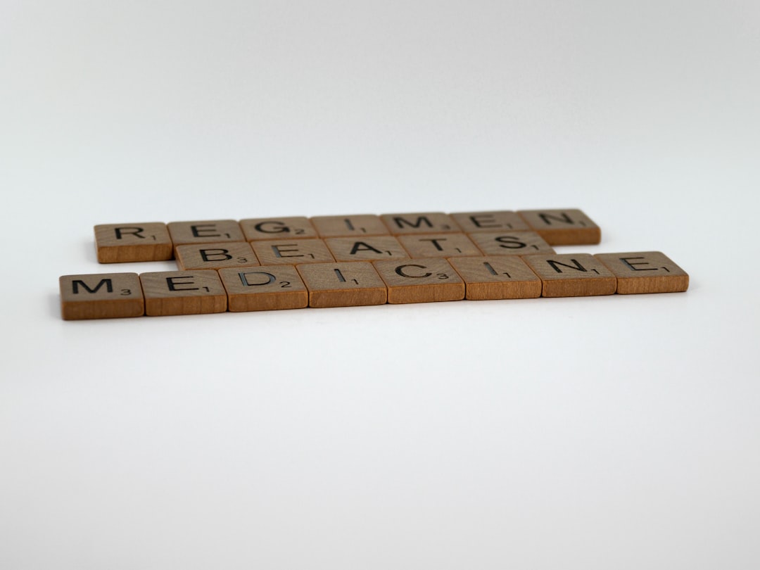 legitimate letter — a couple of scrabbles that are sitting on a table