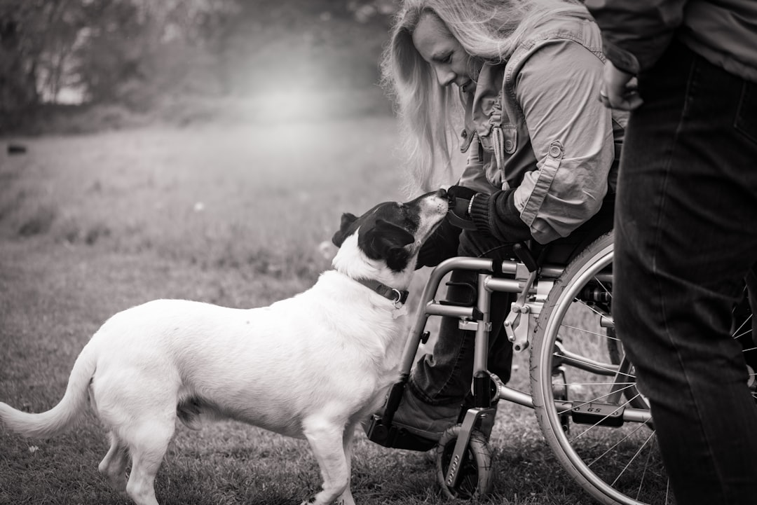 legitimate letter — grayscale photo of woman holding dog